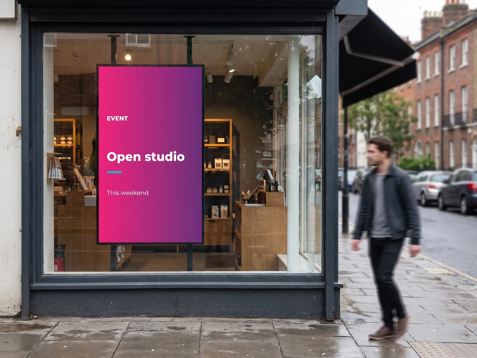 Portrait screen in the window of an independent shop, announcing an open studio at the weekend
