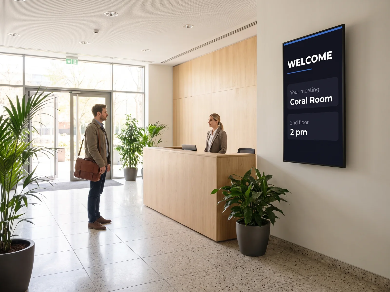 Portrait screen at the reception of a business centre showing a meeting room and its time