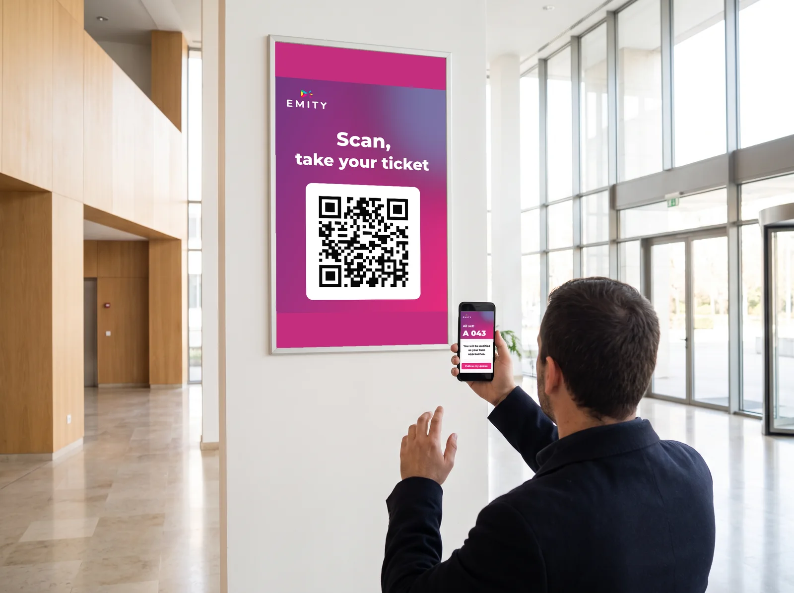 Resident scanning a QR code on a town hall screen to take a queue ticket