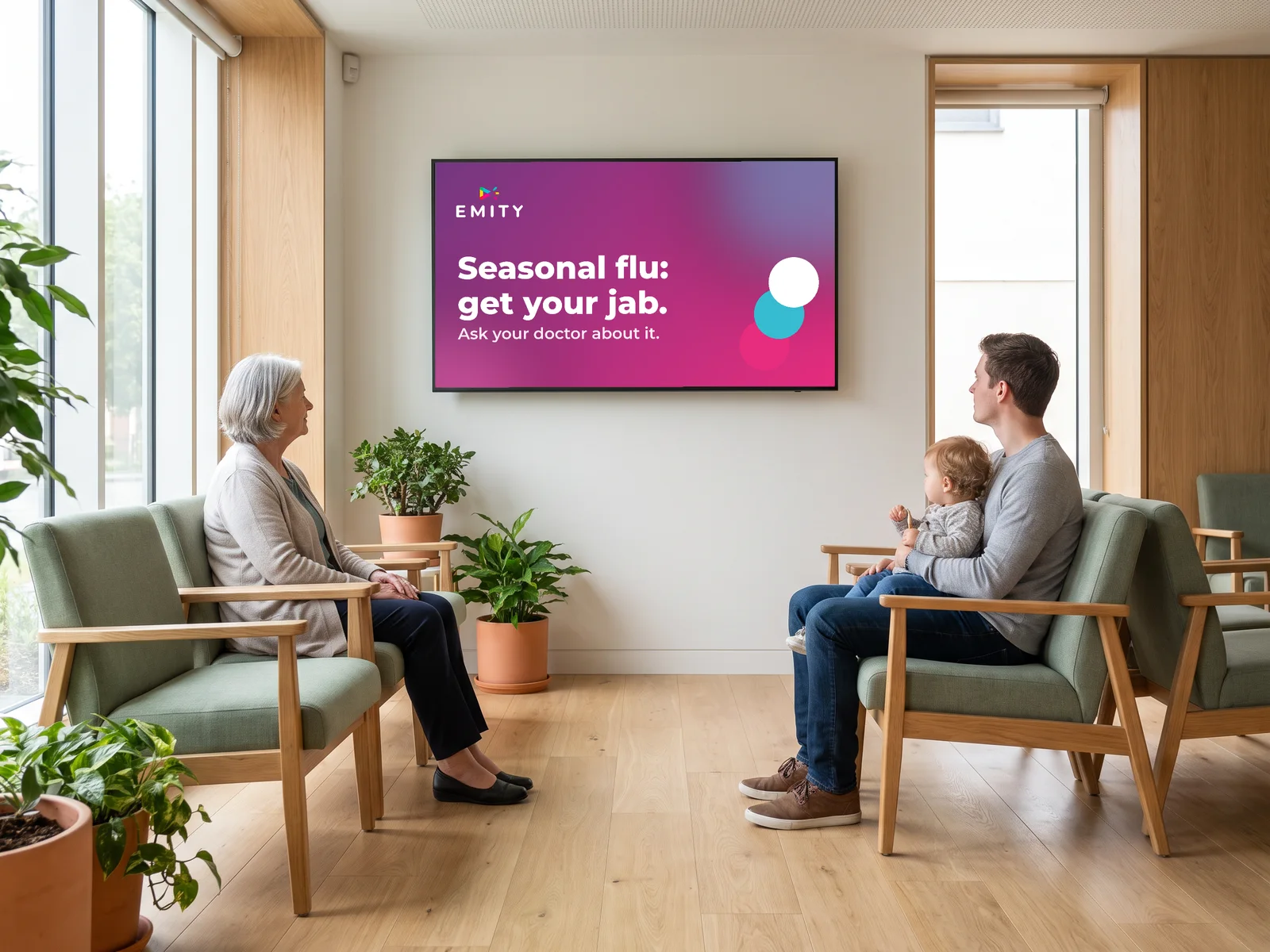 Waiting room of a medical centre: patients look at the seasonal flu prevention screen