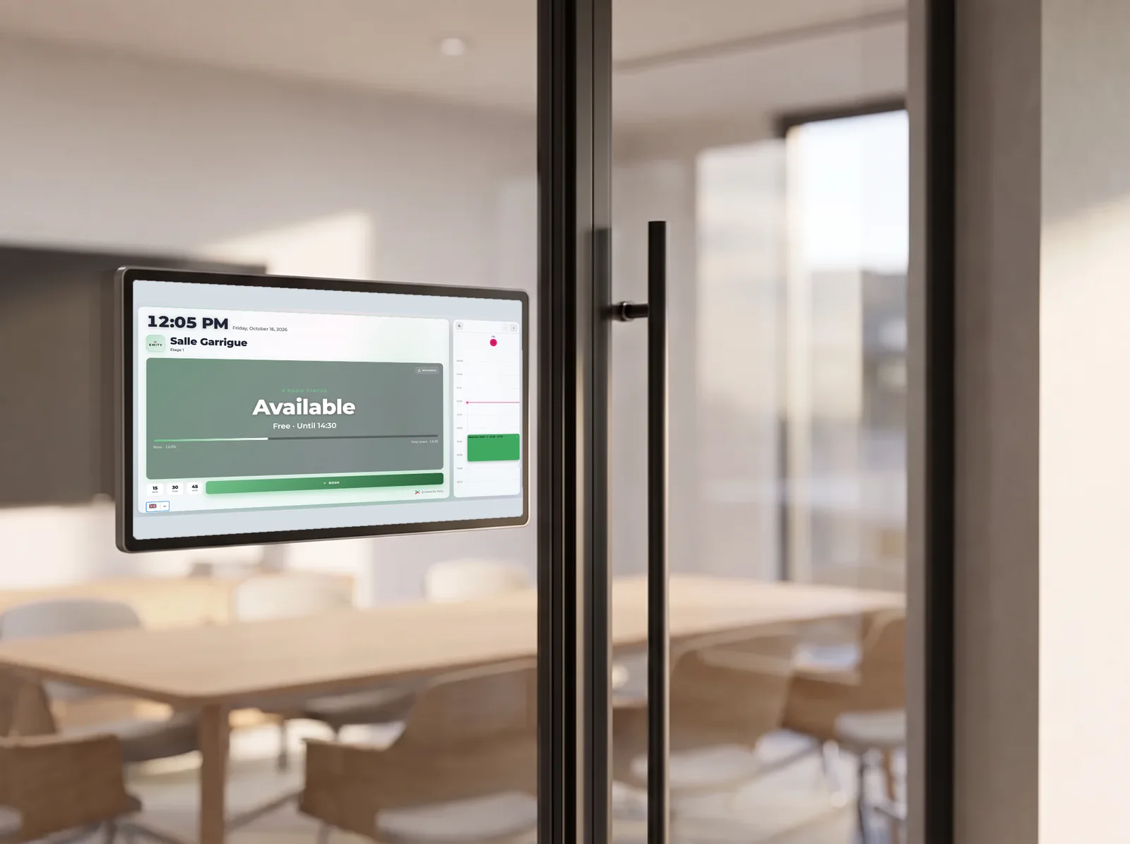 Booking display fixed to the glass door of a meeting room, showing the room as available