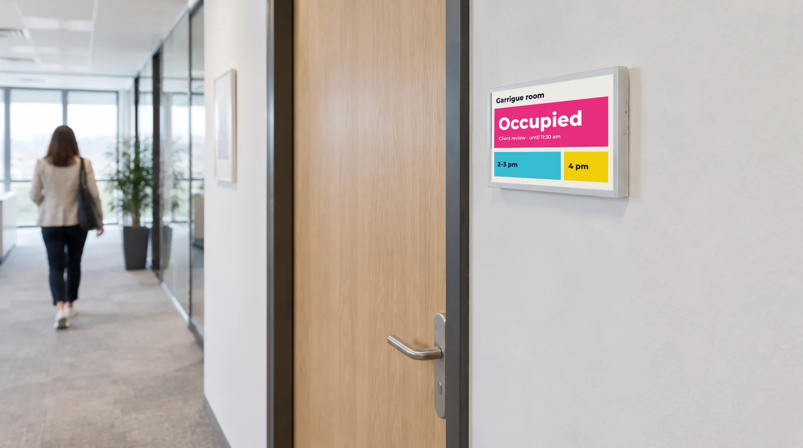 Colour e-paper sign at a room door, showing the room as occupied