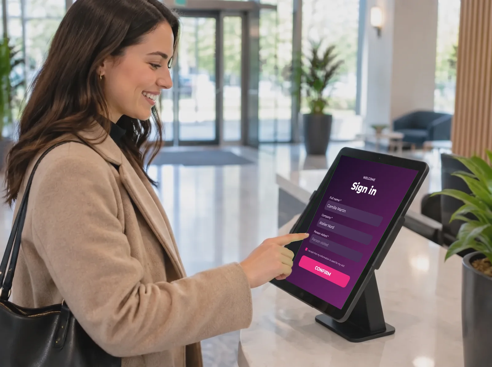 Visitor checking in on a reception tablet