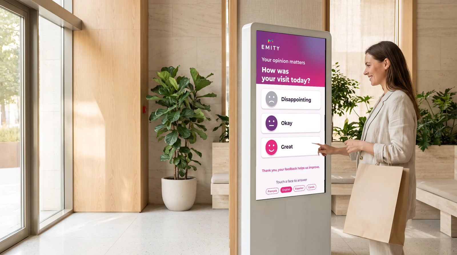Shopper answering a satisfaction survey on a kiosk in a store, three faces to tap